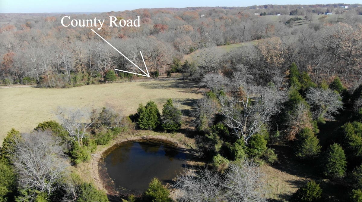 Aerial photo looking west over the pond on the property.